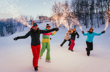 Friends playing on the mountains, celebrating and having fun