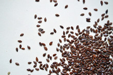 Linen Seeds On The White Background