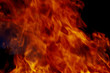© AKlion - Red flames on black background.