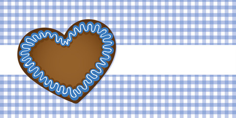 Wall Mural - gingerbread heart on blue checkered tablecloth