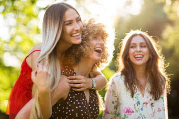 Wall Mural - Group Of Three Female Friends Having Fun Together
