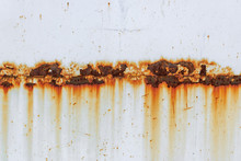 Corrosion Of Welding Seam With Red Stains On A Old White Metal Sheet. Abstract Background