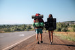 © grthirteen - Travel man hitchhiking. Backpacker on road