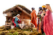 Christmas nativity scene with Holy Family in the hut and the three wise men, isolated on white background