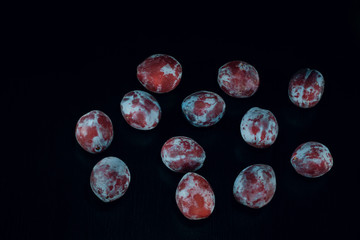 plum on black wood