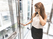 © xartproduction - woman pressing elevator button. finger presses elevator button. businessman in lift