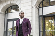 © xartproduction - stylish businesswoman with briefcase on city background. African American man talking on mobile phone