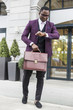 © xartproduction - stylish businesswoman with briefcase on city background. African American man talking on mobile phone