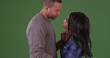 © Mark Adams - sweet and loving young couple embracing ready to kiss on green screen