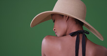Woman Wearing Big Sunhat With Back To Camera On Green Screen