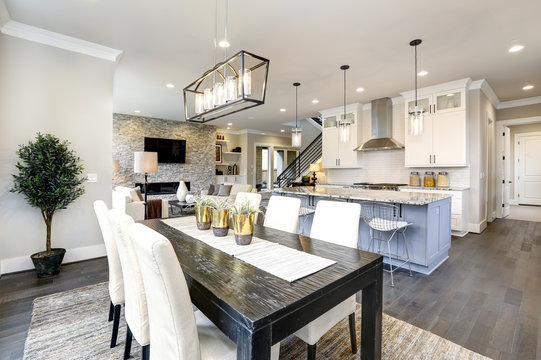 beautiful kitchen in luxury modern contemporary home interior with island and chairs