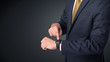 © ra2 studio - Man wearing suit with smartwatch on his wrist.