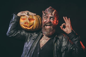 Wall Mural - Halloween satan with smile, beard, wounds, red blood on face