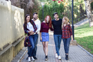 Group of young people together outdoors in urban background