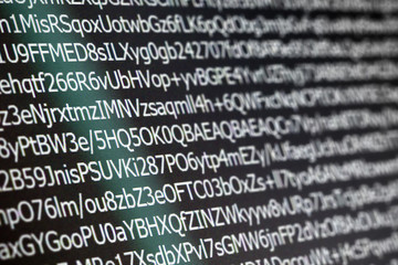 close up macro shot selective focus of computer encoding screen.