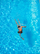 © Netfalls - woman swimming in the pool