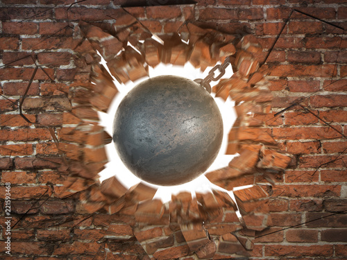 Fotografía Wrecking ball destroying the brick wall