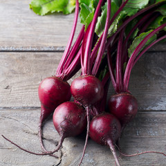 Fresh organic beet, beetroot on grey rustic wooden background. Top view.