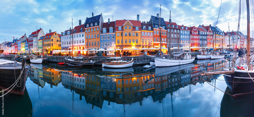 Panorama of north side of Nyhavn with colorful facades of old houses and old ships in the Old Town of Copenhagen, capital of Denmark. - obrazy, fototapety, plakaty 