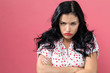 Angry young woman on a solid background