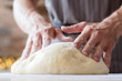 © golubovy - baker courses. food preparing and culinary training class concept. man hands ready to knead dough.