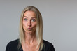 © michaelheim - Astonished woman staring wide eyed at camera