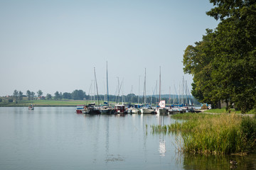 Canvas Print - Marina and pier on Rynskie lake, town of Ryn.