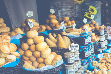 Traditional polish smoked cheese oscypek on christmas market in Cracow. Oscypek is made exclusively in Tatra Mountains region of Poland