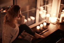 romance adult girl candles / sexy model in a romantic interior lonely waiting