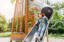 Adult Or Teenager Girl Having Fun On Playground