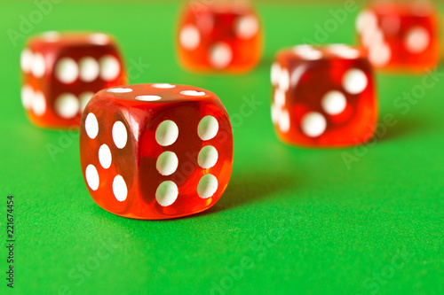 фотография Dice on a green background . Game concept. Games of chance