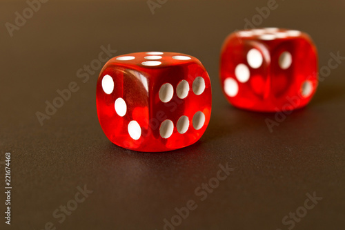 фотография Dice on a black background . Game concept. Games of chance.