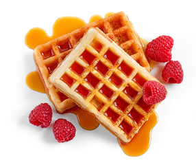 waffles with syrup and raspberries