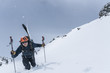 Skier hiking in deep snow