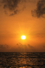 Wall Mural - Sunset on the Maldives ocean