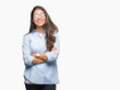© Krakenimages.com - Young beautiful arab woman wearing glasses over isolated background happy face smiling with crossed arms looking at the camera. Positive person.