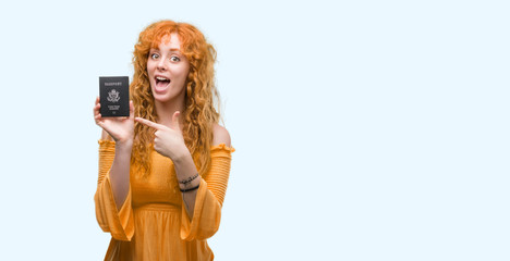 Poster - Young redhead woman holding passport of United States of America very happy pointing with hand and finger