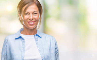 Canvas Print - Middle age senior hispanic woman over isolated background with a happy and cool smile on face. Lucky person.