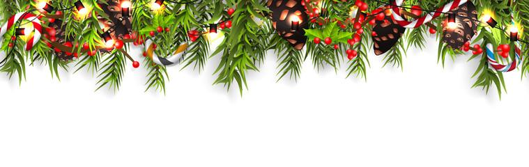 Christmas border with fir branches, pine cones, holly, and string lights. Merry Christmas background with open space for your text.