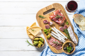 Sticker - Italian antipasto with salami, jamon and olives on white.