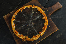 Crunchy Crusts Of Delicious Pizza On The Wooden Board