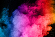 Abstract Colored Dust Explosion On A Black Background.abstract Powder Splatted Background,Freeze Motion Of Color Powder Exploding/throwing Color Powder, Multicolored Glitter Texture.