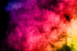 © kitsana - abstract colored dust explosion on a black background.abstract powder splatted background,Freeze motion of color powder exploding/throwing color powder, multicolored glitter texture.