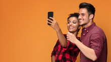 Mixed Race Couple Taking Selfie.