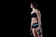 © zhagunov_a - young muscular sports girl engaged with weight
