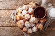 Albanian traditional food: fried dough petulla with raspberry jam and powdered sugar close-up. horizontal top view