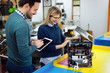 © NDABCREATIVITY - Young attractive students of mechatronics working on project