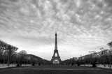 Fototapeta Boho - Beautiful cityscape of the Eiffel tower on a cloudy winter day in Paris in black and white
