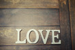 © alexkich - word Love from wooden letters on background