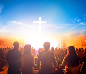 Wall Mural - worship concept:silhouette people looking for the cross on sunrise background